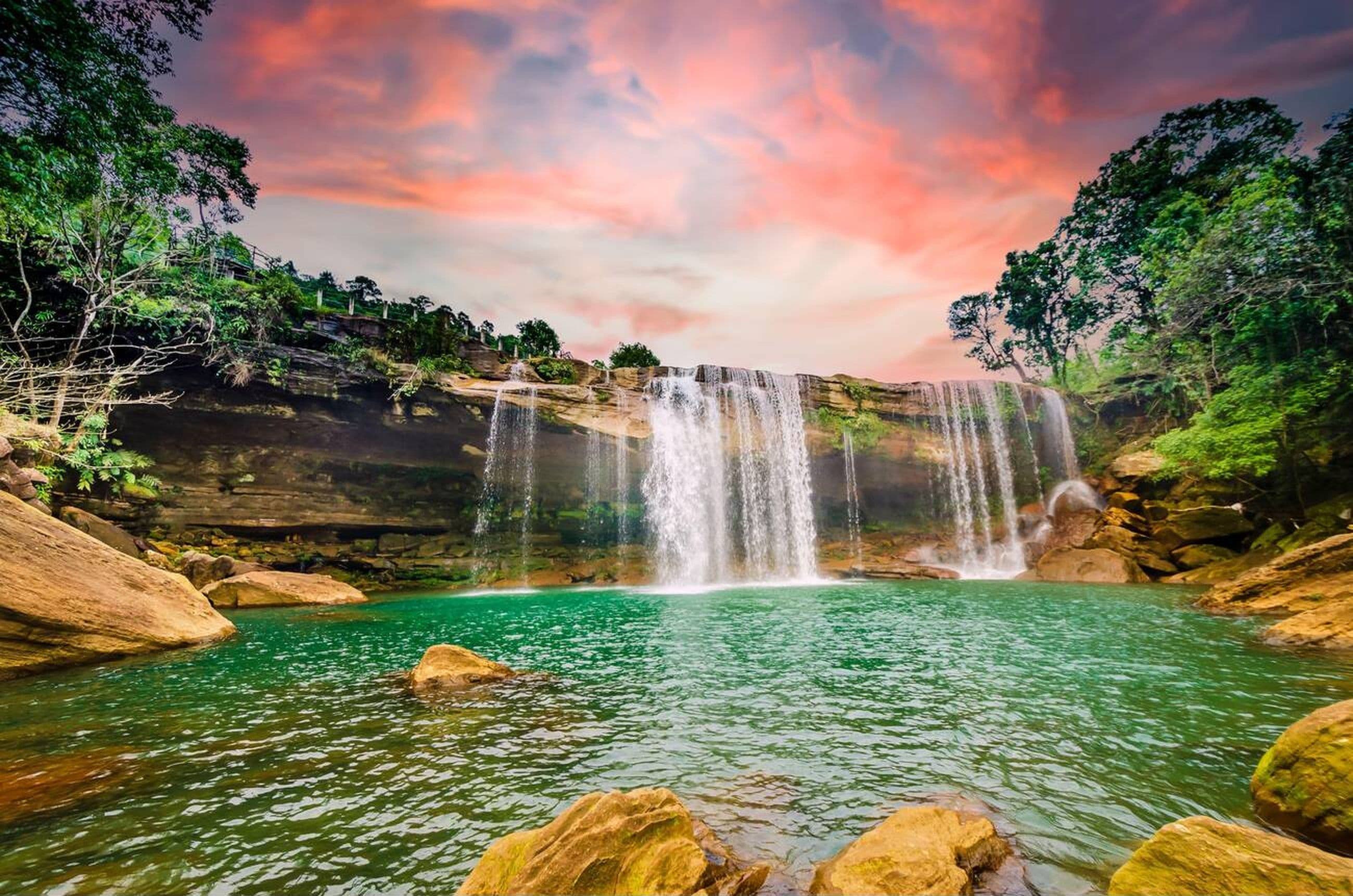 Beautiful waterfalls in Meghalaya flowing through lush green hills and misty valleys in Northeast India