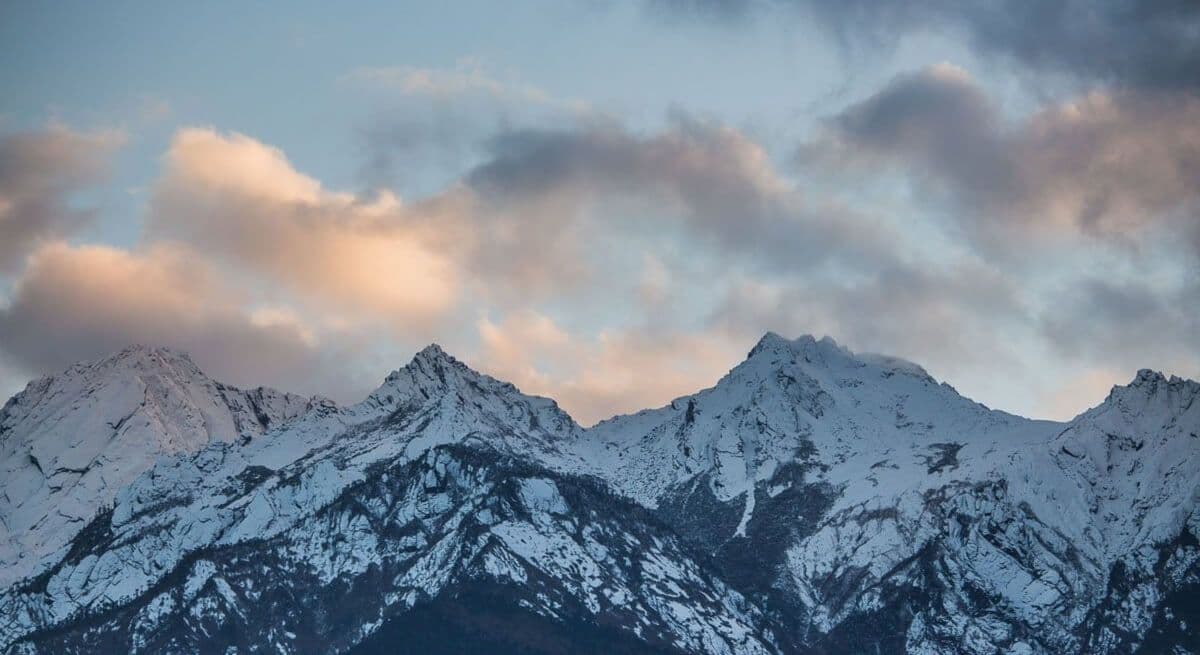Snow-covered Mechuka Valley in Arunachal Pradesh with white Himalayan mountains, frozen landscapes, and scenic winter views